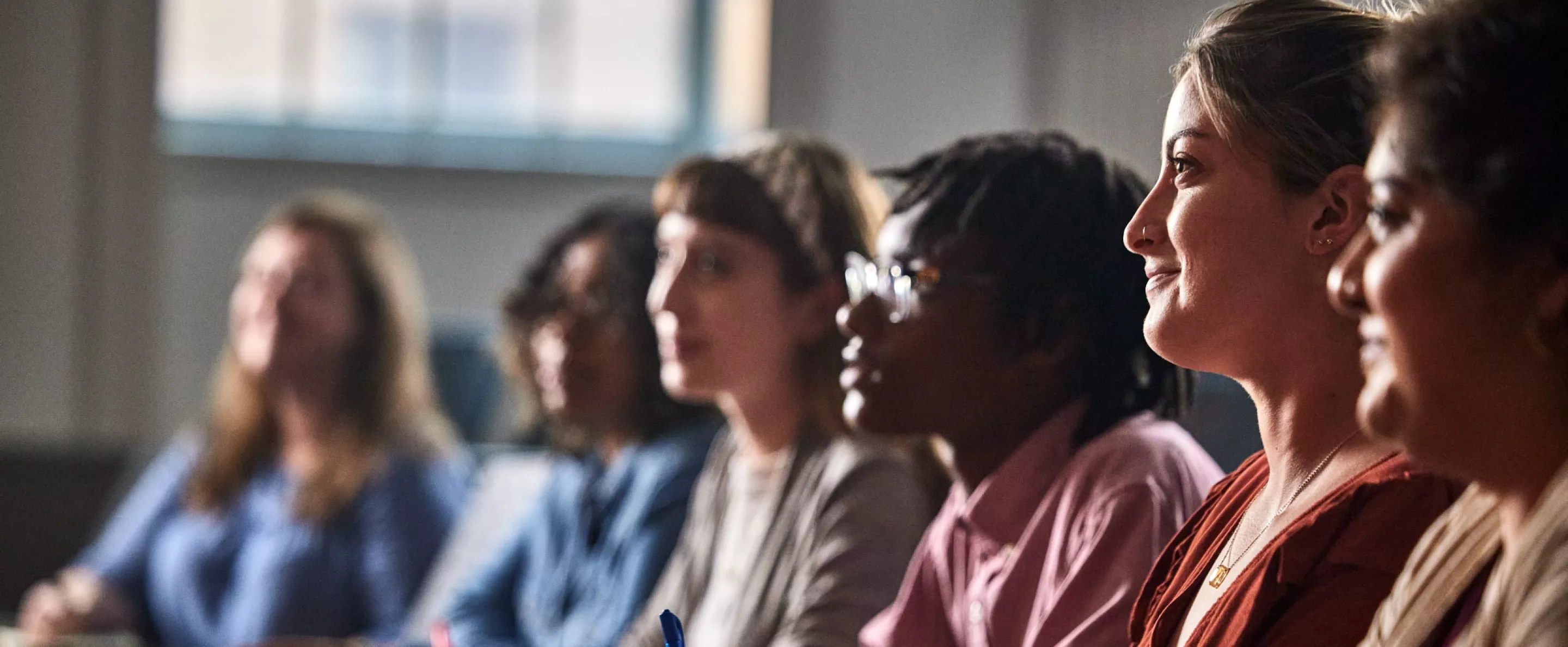 Multiple law students listen to a lecture