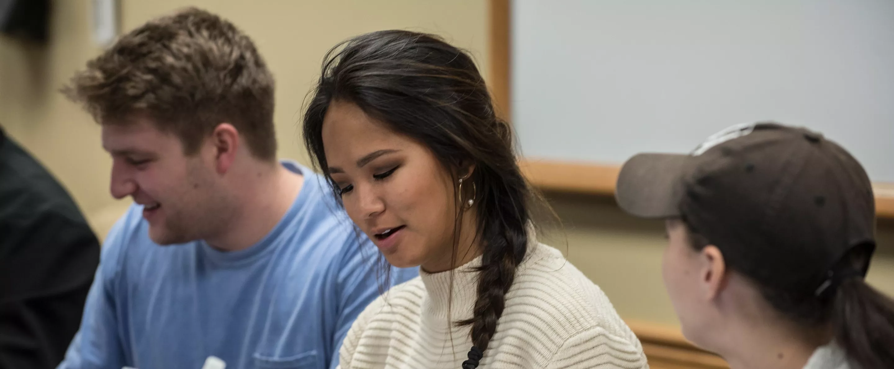 Student in a law class talking with other students.