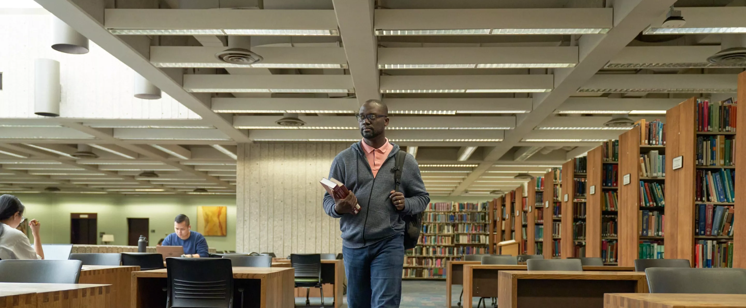Student walks into the library.