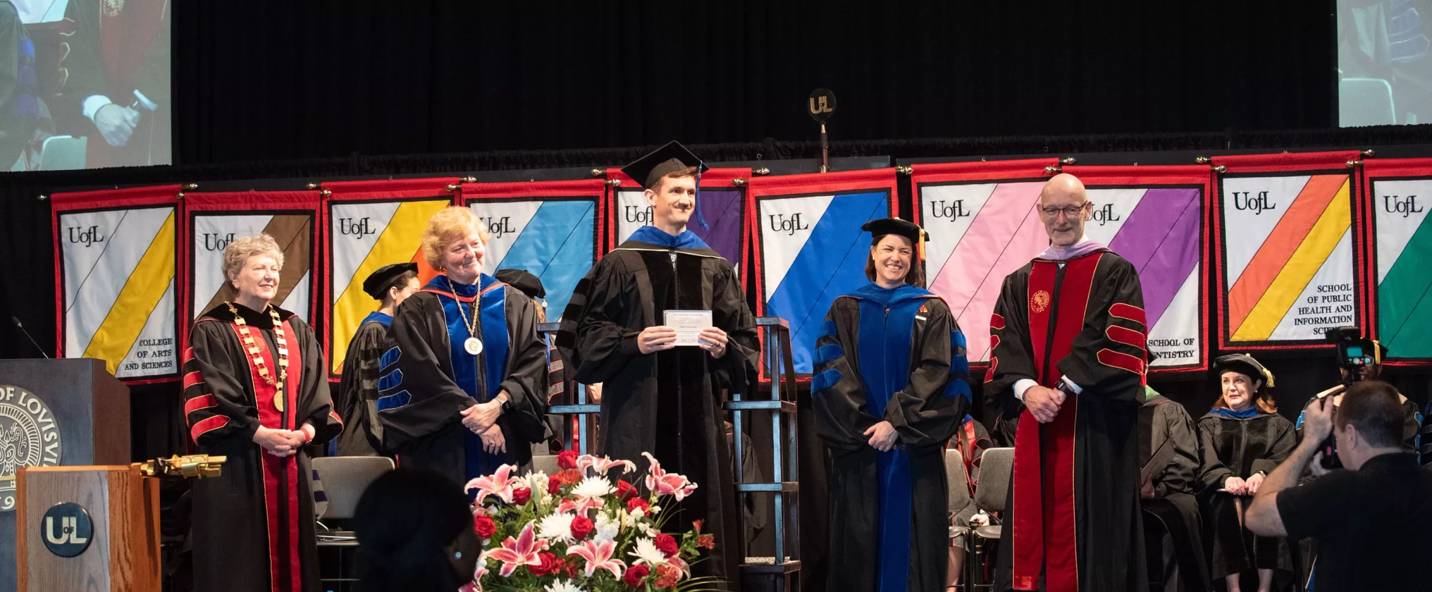 Faculty Mentor receiving award during hooding ceremony.