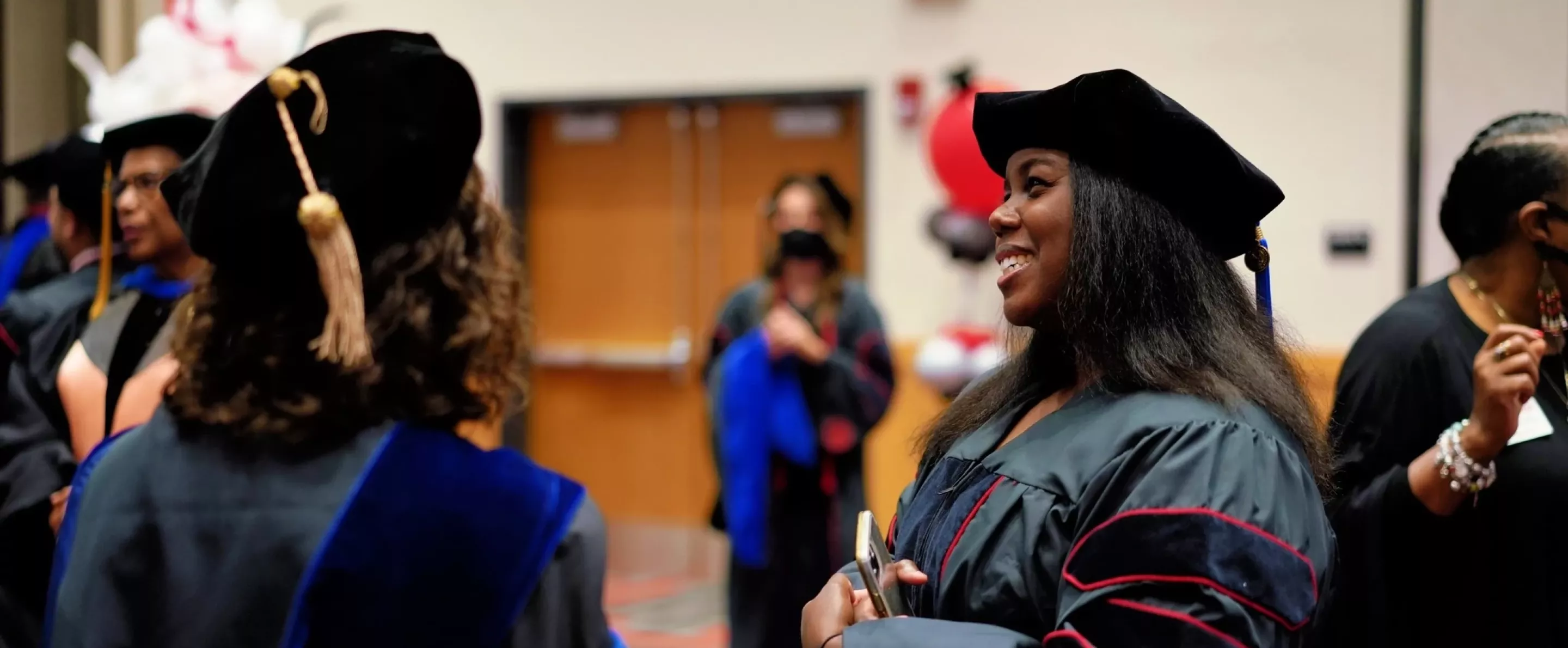 Students smiling at graduatio