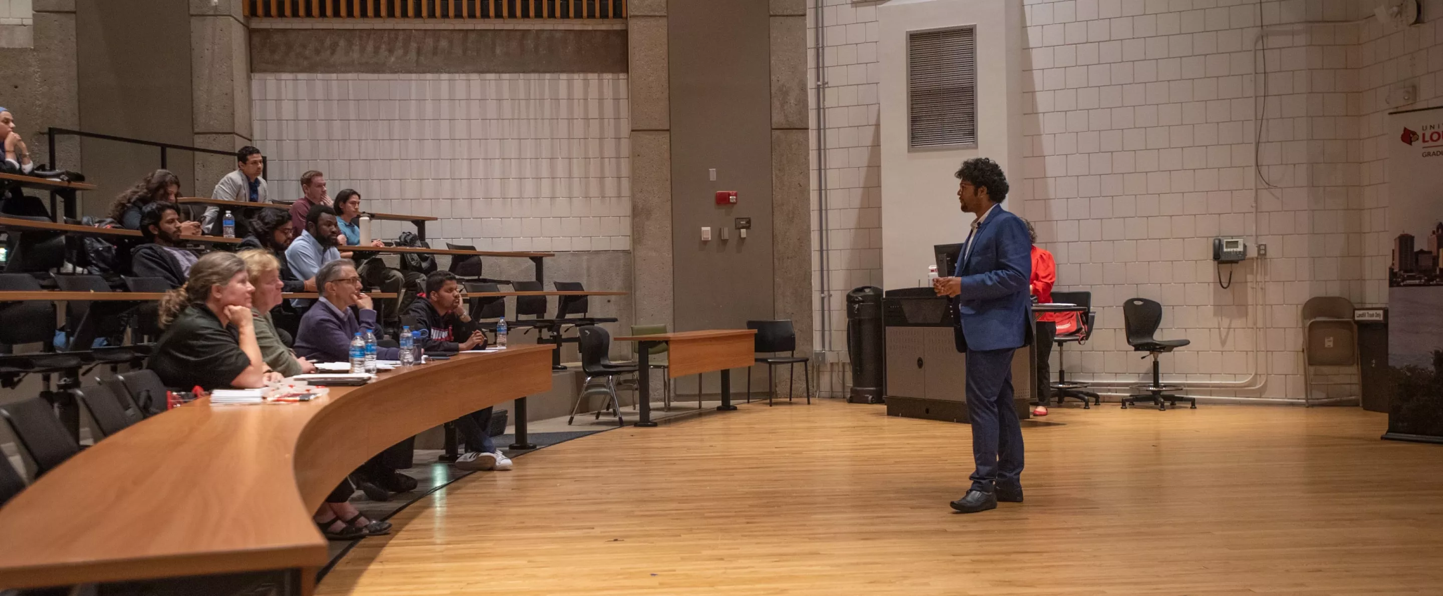 Graduate student Aditiya Sarkar presenting research during 3MT.