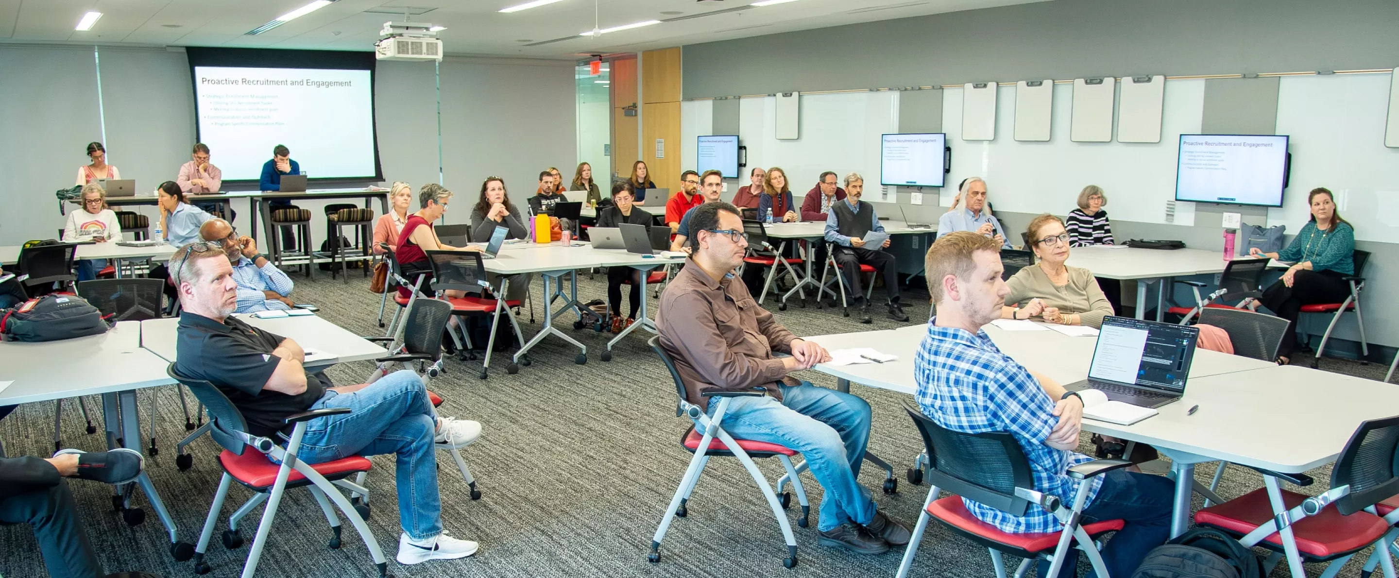 Directors of Graduate Studies and Graduate School staff members sitting in a meeting