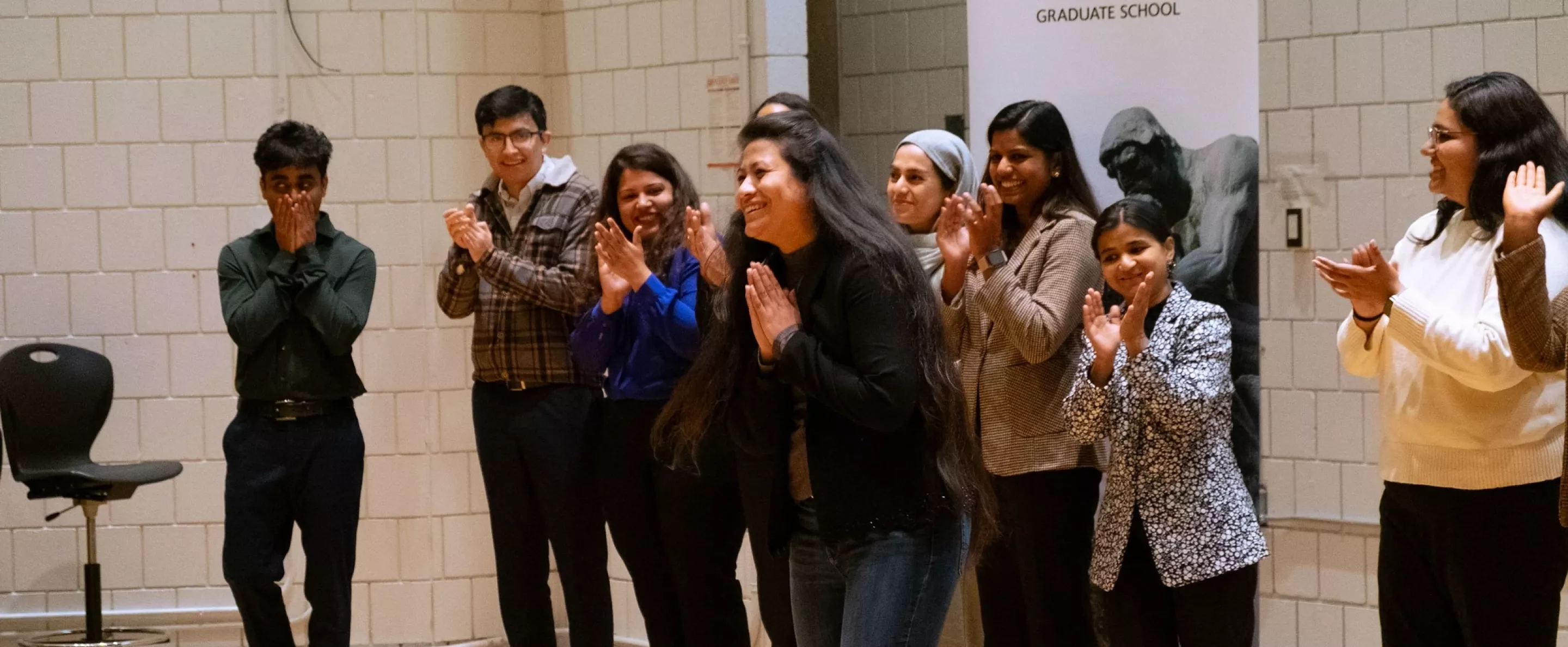 Smriti Maskey announced as winner of UofL's 2025 3-Minute Thesis Competition in front of group.