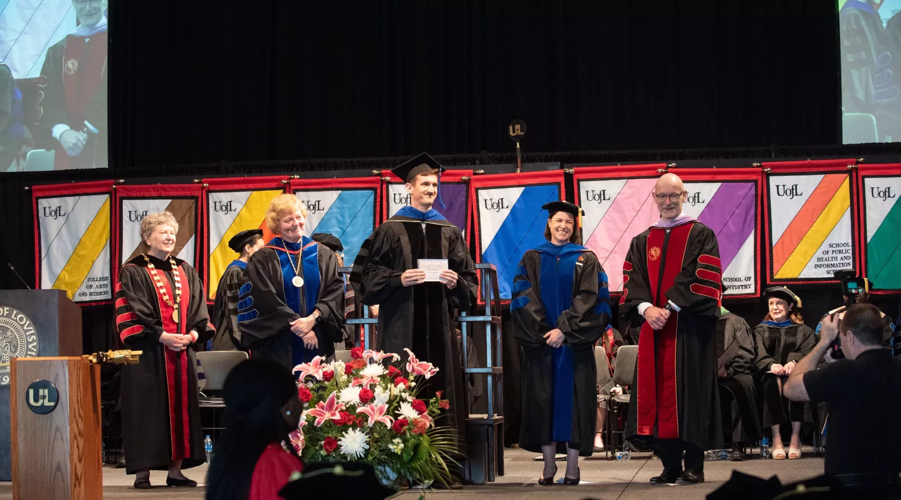 Faculty Mentor receiving award during hooding ceremony.