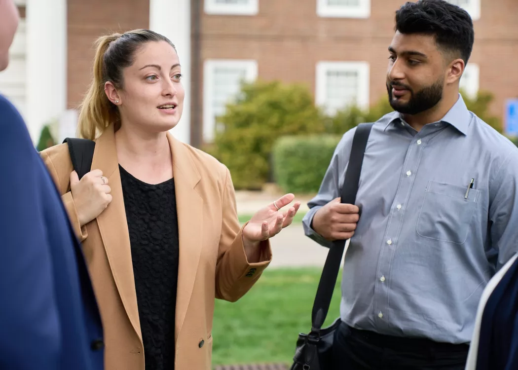 Law students talking in the courtyard of the Brandeis School of Law.