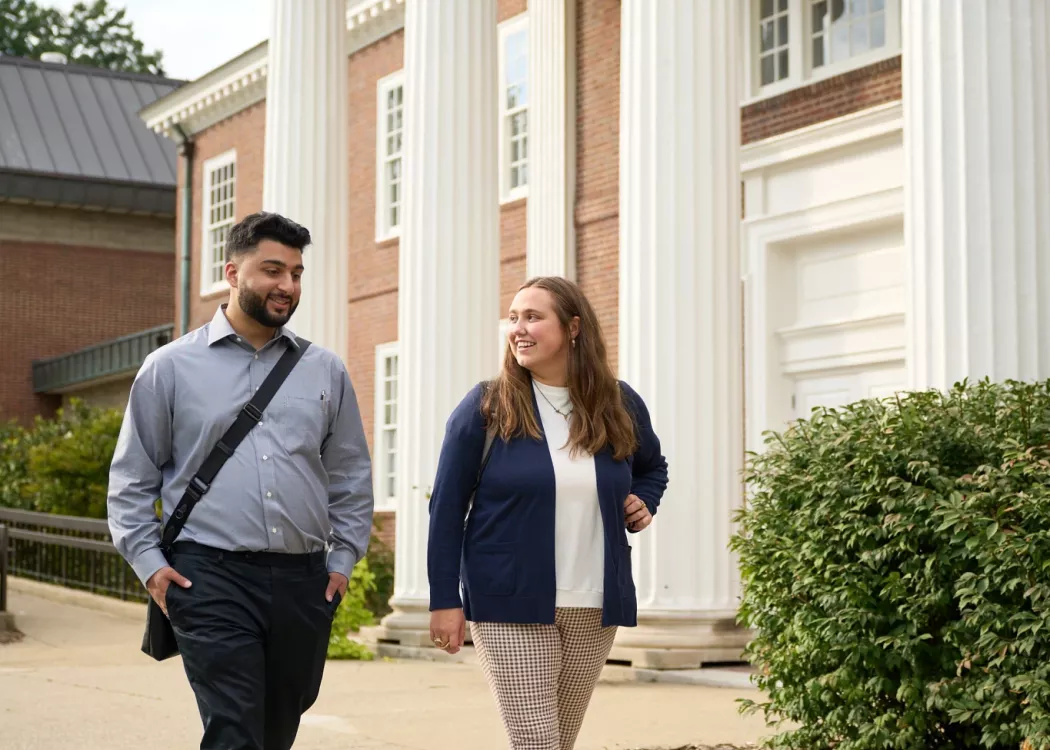Two law students walking by the law school.