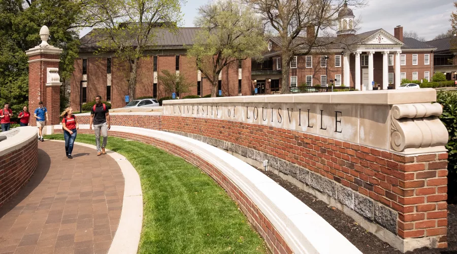 Students walking in front of Grawemeyer Hall oval