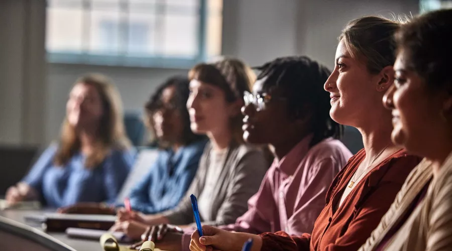 Multiple law students listen to a lecture