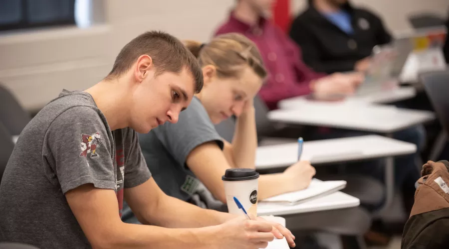 Students take notes during a lecture