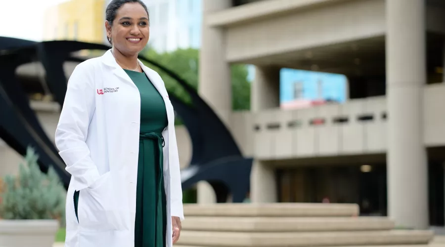 Female doctor posing for the campaign in front of HSC campus.