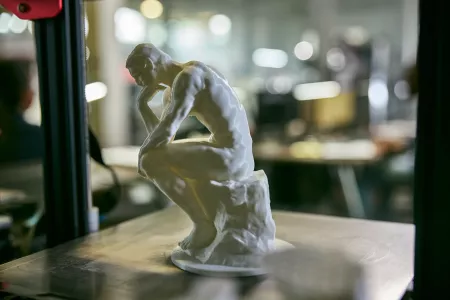 A miniature sculpture of the Thinker in the AMIST facility.